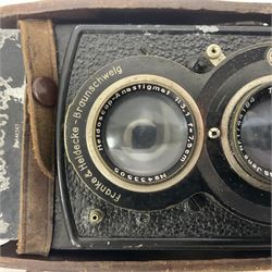 Franke & Heidecke Rolleiflex twin lens camera, serial number 441347, with 'Heidoscop-Anastigmat 1:3.1 f=7.5cm' lens, serial number 433505 and a 'Tessar1:35f=7.5cm' lens, serial number 1744185, together with two Rolleicord DRP twin lens cameras, all within leather carrying cases 