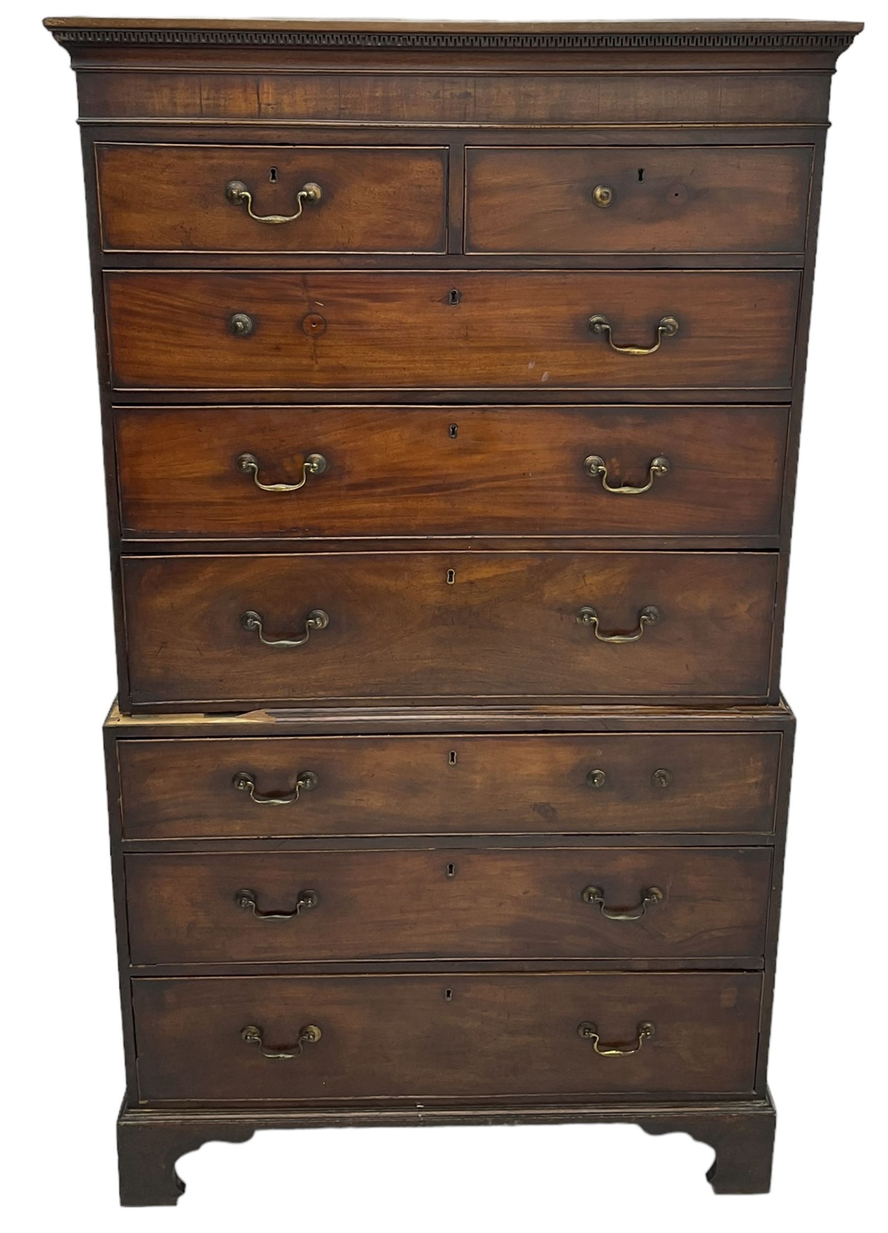 George III mahogany chest on chest, projecting cornice over plain frieze, fitted with two short and six long graduating cock-beaded drawers, on bracket feet