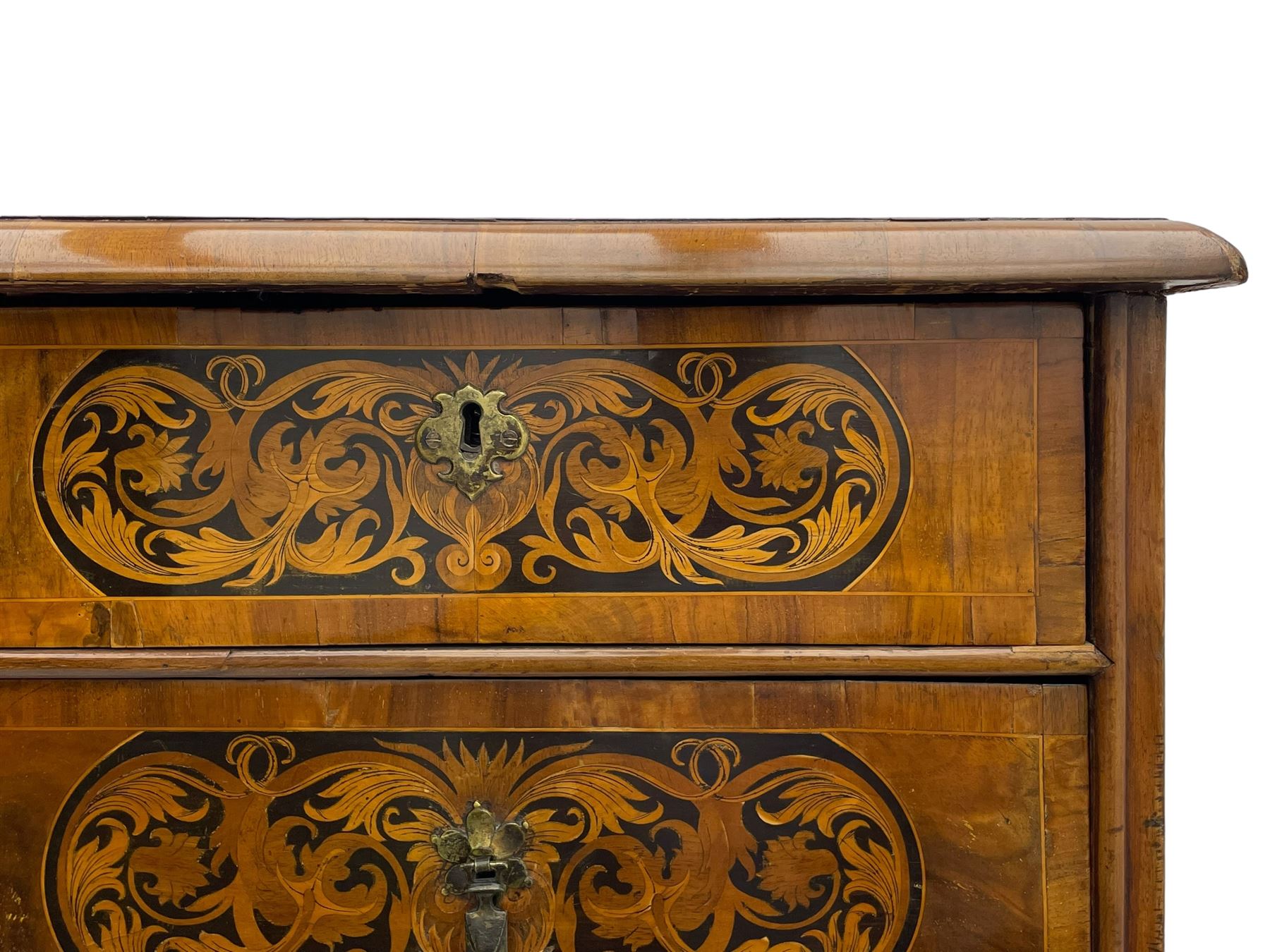 18th century inlaid walnut chest on stand, ovolo-moulded rectangular top inlaid with ebony panels each decorated with scrolling foliage, flower heads and birds, fitted with two short over three long drawers, the drawer fronts decorated with ebony panels enclosing curled leaf inlays, the base fitted with single drawer on turned supports united by waved stretchers, on turned bun feet 