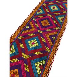 Flatweave geometric design runner rug, decorated with trailing lozenges decorated with hooked motifs, within zig-zag bands, bright multi-coloured ground 