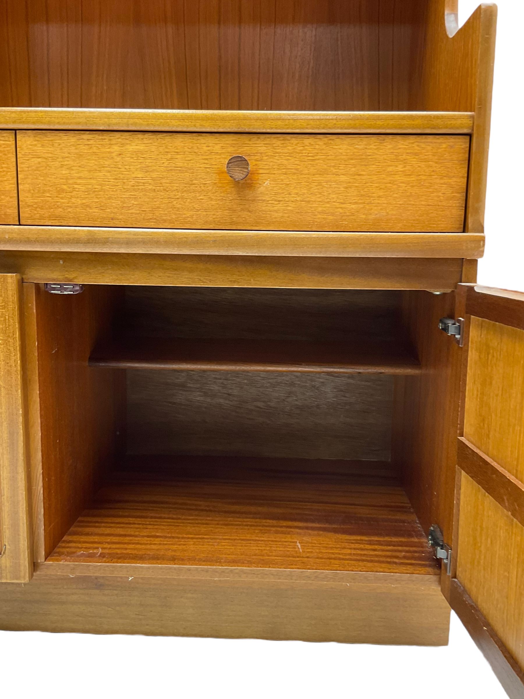 Nathan - teak wall unit, fitted with raised display cabinet and fall front compartment, three drawers and three cupboards below