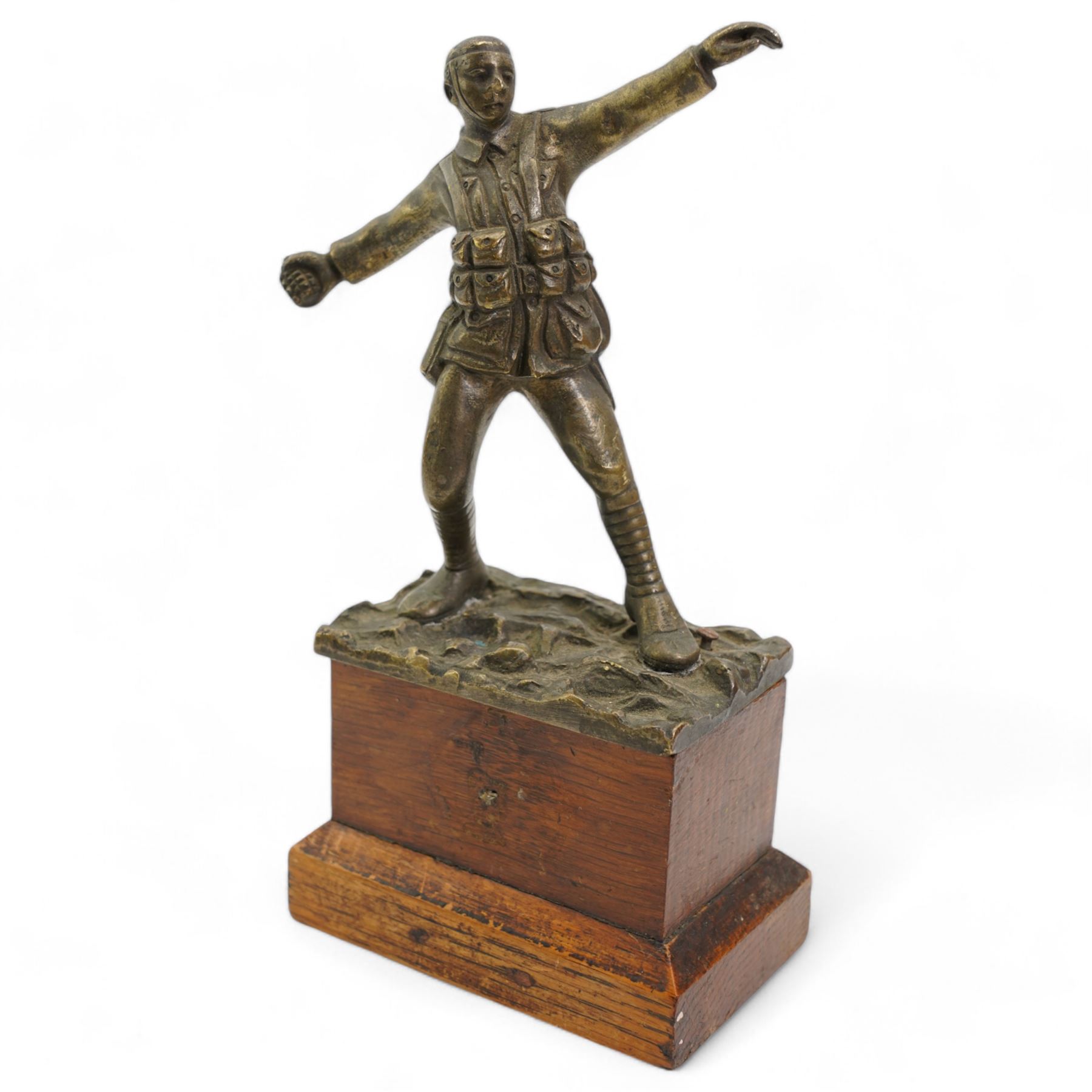 Sydney Wilkinson - bronze of a WWI soldier in the act of throwing a hand grenade, signed and on pine base H19cm 