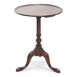 George III mahogany wine table, the circular dished top raised on a turned pedestal, termi...