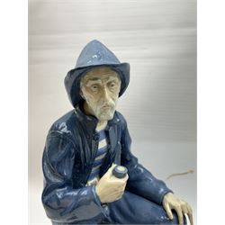 Lladro figure, Girl in Traditional Dress no 1159, together with Nao figure Old Fisherman Smoking a Pipe