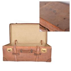 Early 20th century leather trunk, with brass fixtures, leather straps and buckle fastening...