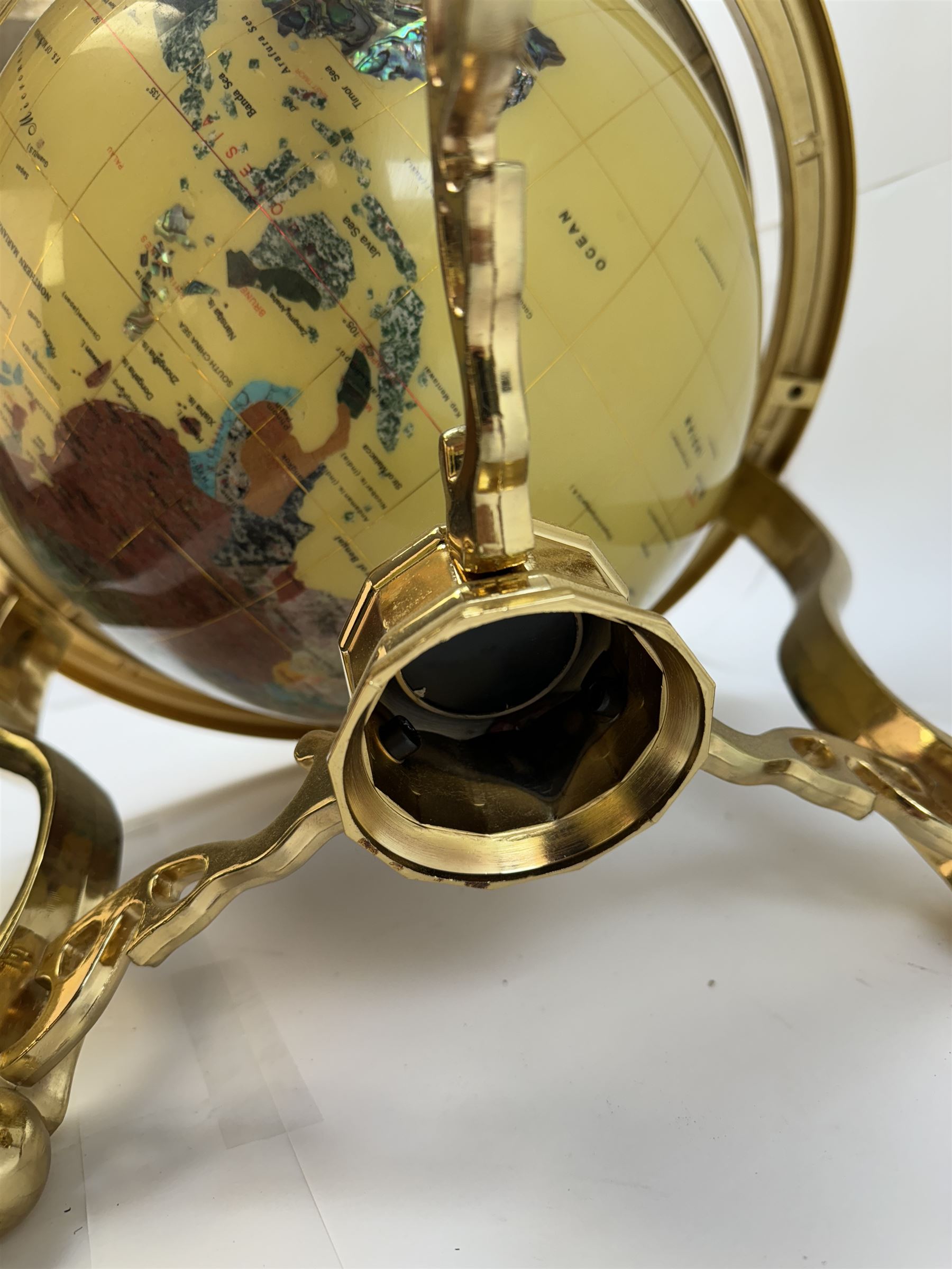 Polished gemstone terrestrial globe on gilt metal stand, H47cm