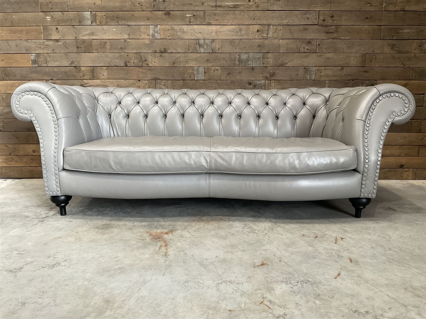 Three seat Chesterfield sofa, upholstered in grey buttoned leather