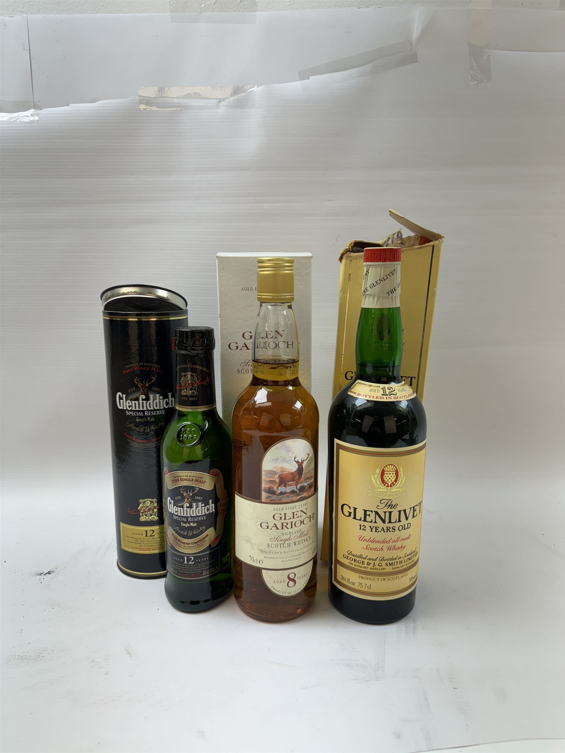 Three bottles of Scotch Whisky, including Glenlivet, 12 year old, Gen Garioch 8 year old and Glenfiddich 12 year old, various contents and proof 