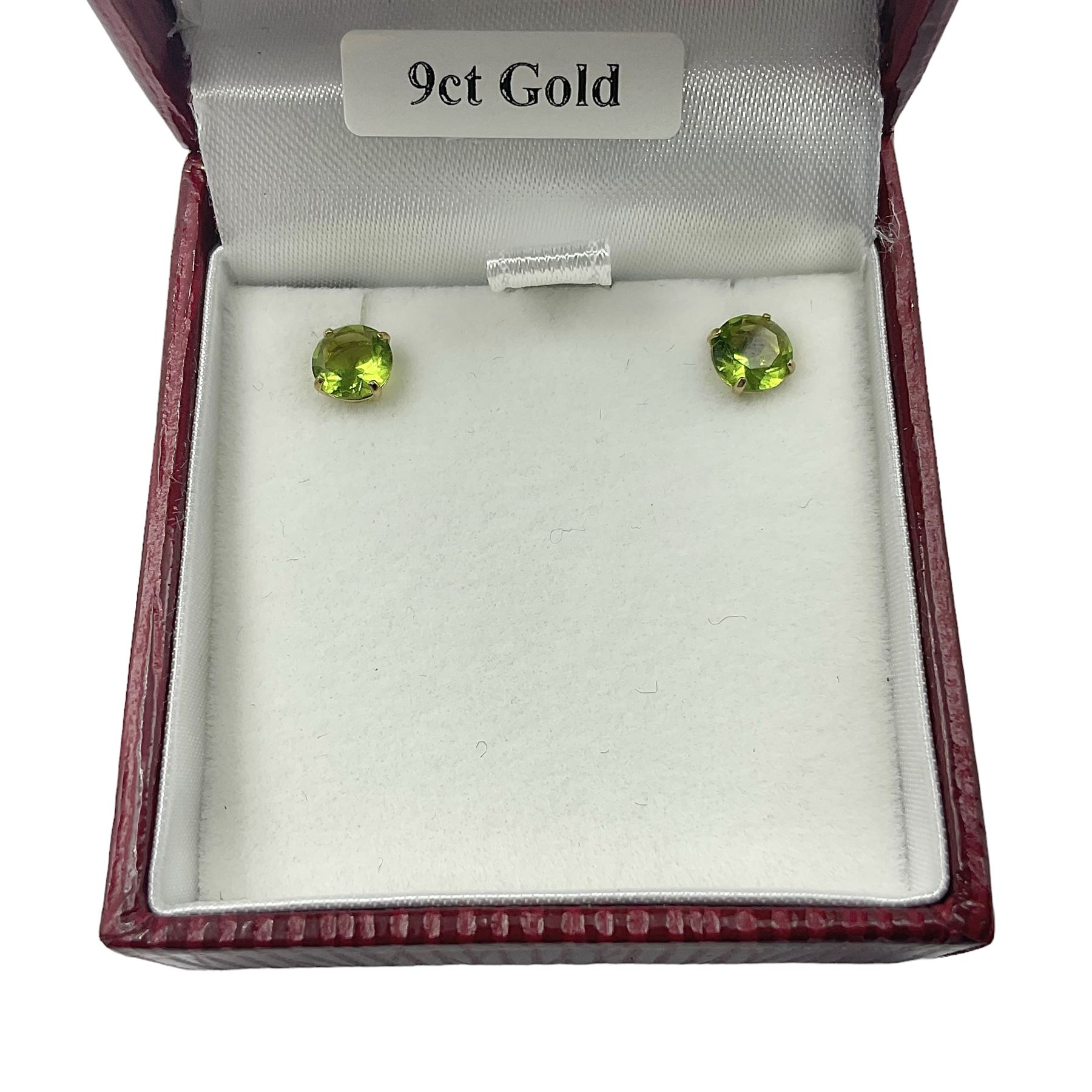 Pair of 9ct gold green stone stud earrings, boxed