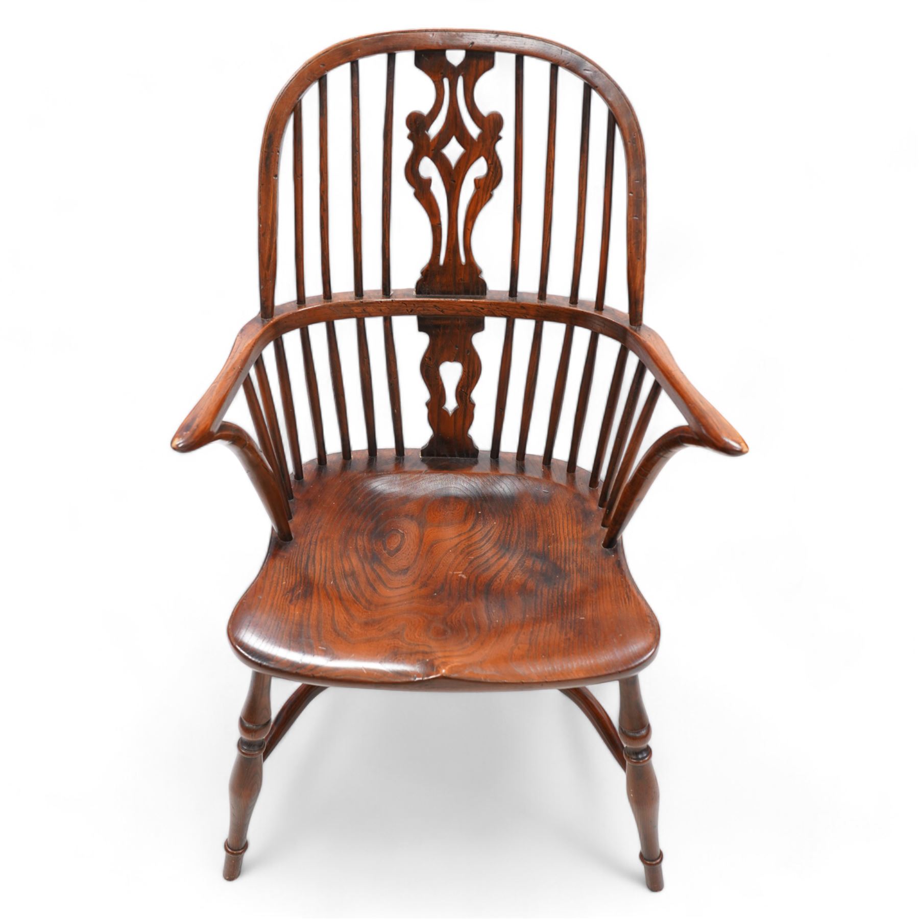 Ash and elm Windsor armchair, double hoop and stick back with shaped and pierced splat, dished saddle seat on turned supports united by crinoline stretcher 