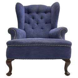 Early 20th century wingback armchair, upholstered in buttoned blue fabric, rolled and scrolled arms, on cabriole feet