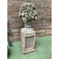 Cast stone garden fruit centrepiece on square base, pair of cast iron bench ends, and three planters - THIS LOT IS TO BE COLLECTED BY APPOINTMENT FROM DUGGLEBY STORAGE, GREAT HILL, EASTFIELD, SCARBOROUGH, YO11 3TX