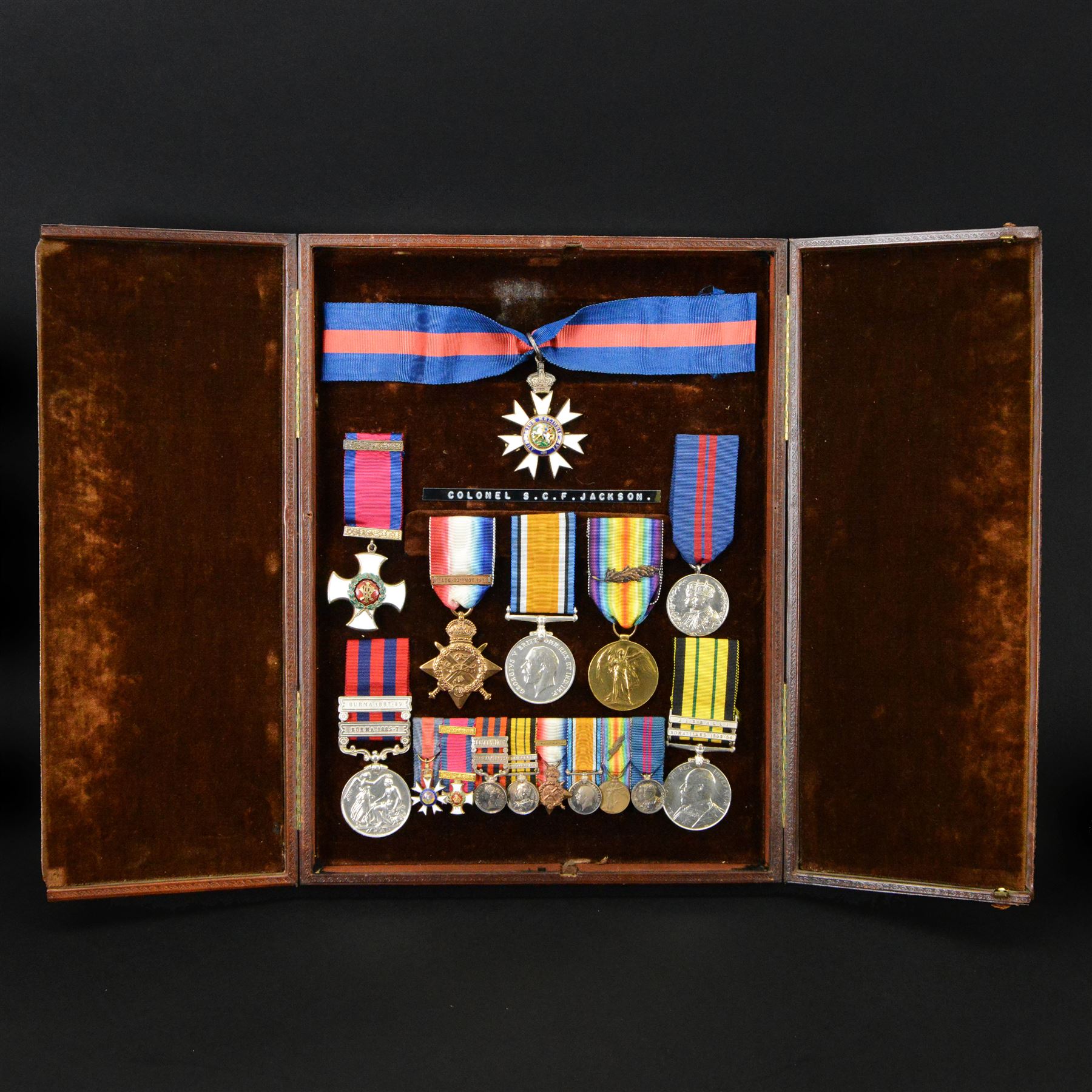 Colonel S.C.F Jackson 1st battalion Hampshire Regiment, group of eight medals and corresponding miniatures in display case, comprising The Most Distinguished Order of St. Michael and St. George, C.M.G, Distinguished Service Order, India General Service Medal Burma with 1885-7 and 1887-89 clasps, General Service Medal Africa with Somaliland 1902-04  clasps, 1911 Coronation medal, 1914 Star, British War Medal and Victory Medal
These medals were awarded to Colonel S.C.F Jackson, his portrait lot 3144 and his sword is lot 3145 