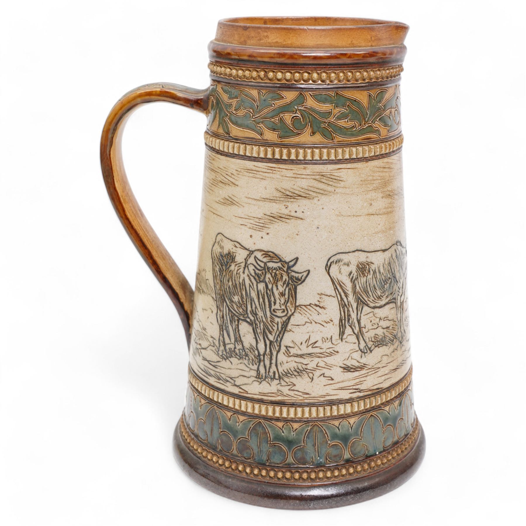 Late 19th century Doulton Lambeth sgraffito jug and beaker by Hannah Barlow, decorated with bands of cattle in landscapes between foliate boarders, with impressed and incised marks beneath, including monogram H24cm (2)