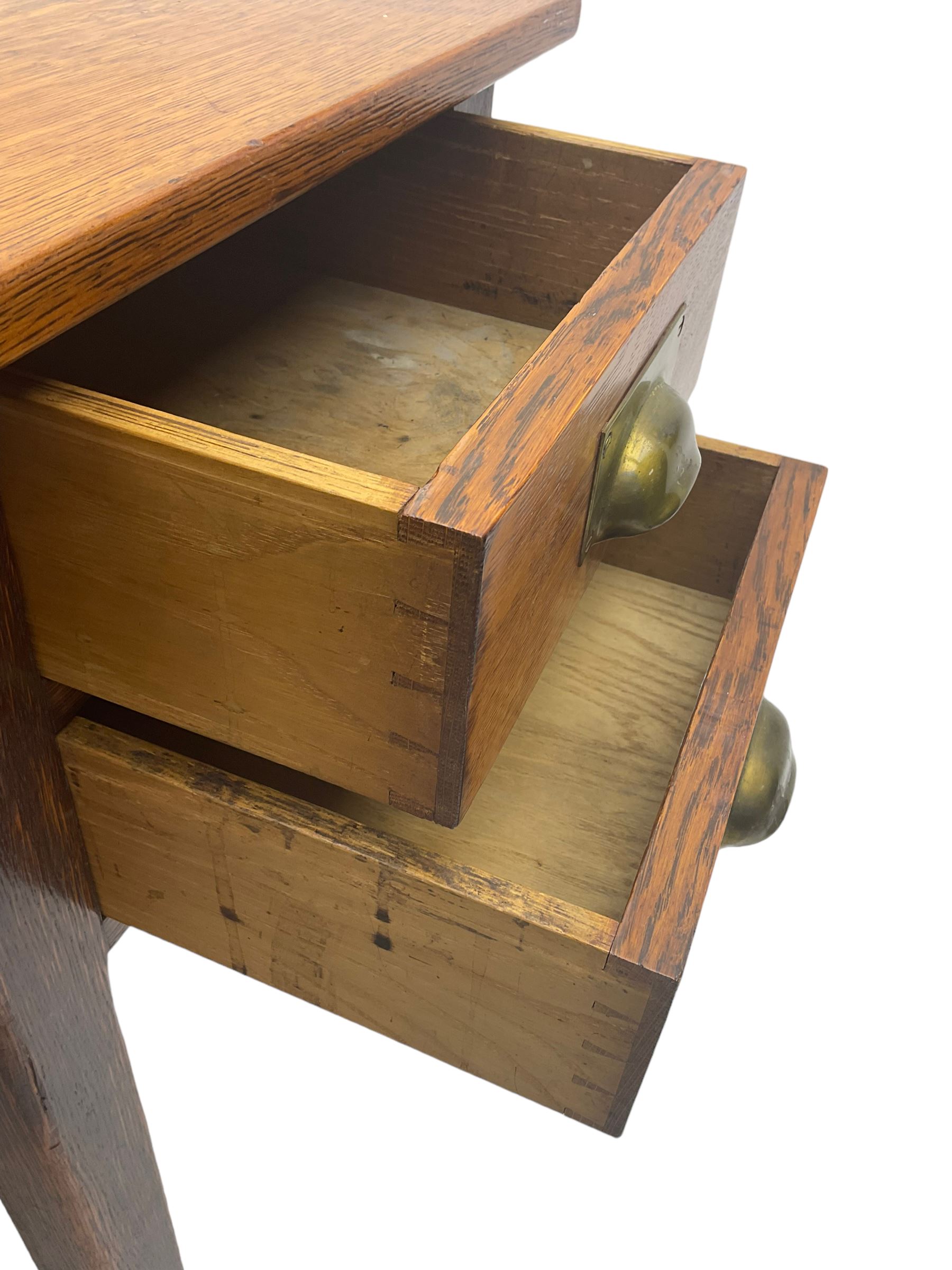 Early 20th century oak clerks desk, fitted with drop centre and drawers, on square supports