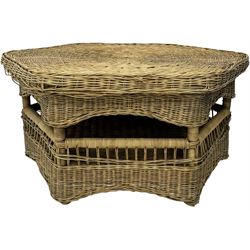 Mid-20th century hexagonal wicker coffee table, featuring woven top with pattern that radiates from the centre, lower shelf for additional storage, supported by interwoven wicker legs