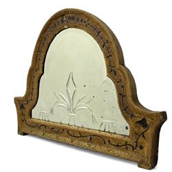 19th century painted pine and gesso wall mirror, stepped arch frame enclosing mirror plate with bevelled stylised leaf decoration and bevelled edge, the frame carved with scrolling leafy branches and painted with black detail, foliate moulded outer edge