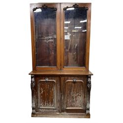 Victorian mahogany bookcase on cupboard, enclosed by two glazed doors, the base enclosed by two panelled doors flanked by acanthus carved upright pilasters, on plinth base