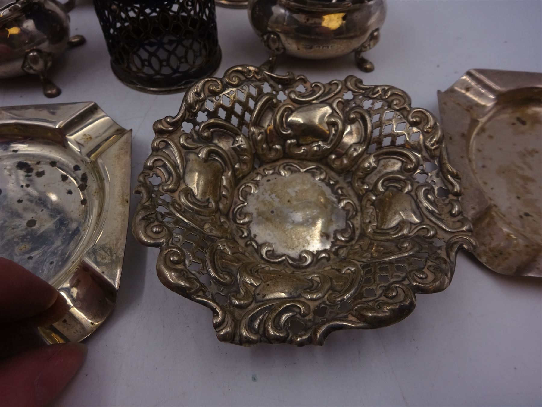 Group of silver, including silver handled button hook, cruet items, two ashtrays and two bon bon dishes, etc, all hallmarked 