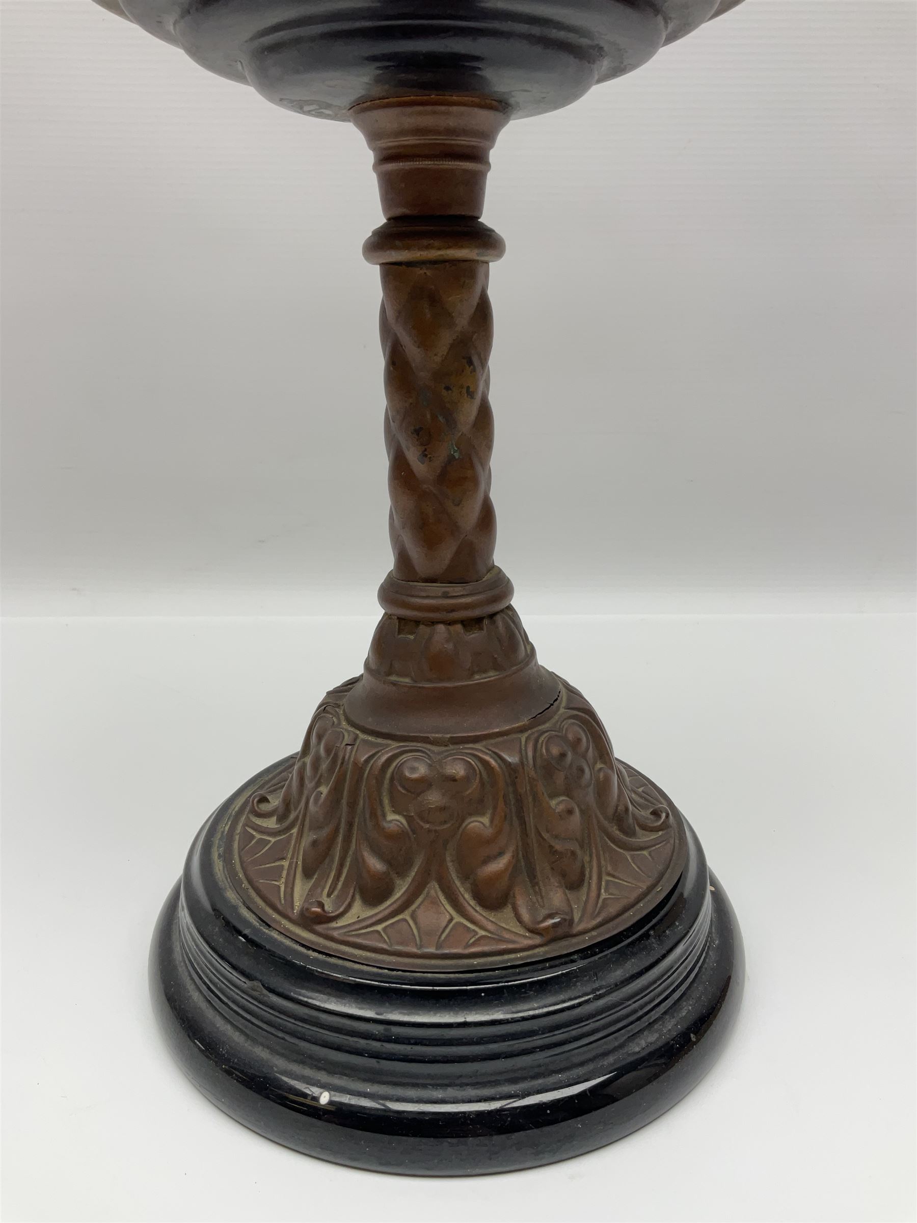 Victorian oil lamp, the faceted reservoir upon embossed copper stem and stepped circular ceramic base, with etched floral glass shade