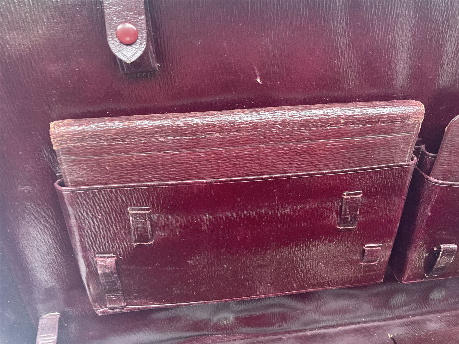 Early 20th century leather bound travelling case, with initials to cover, with fitted interior containing five silver topped glass jars, each engraved with initials, hallmarked The Alexander Clark Manufacturing Co, London 1910 & 1911, case W61cm