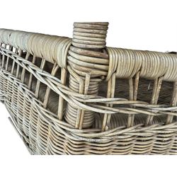 Mid-20th century hexagonal wicker coffee table, featuring woven top with pattern that radiates from the centre, lower shelf for additional storage, supported by interwoven wicker legs