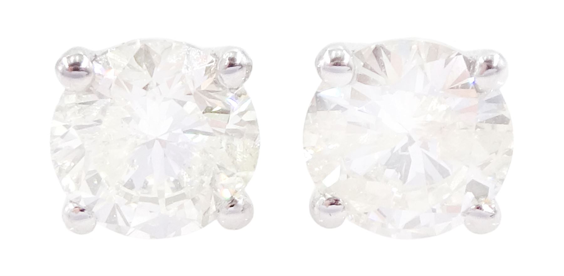 Pair of 18ct white gold round brilliant cut diamond stud earrings, stamped 750, total diamond weight approx 1.05 carat