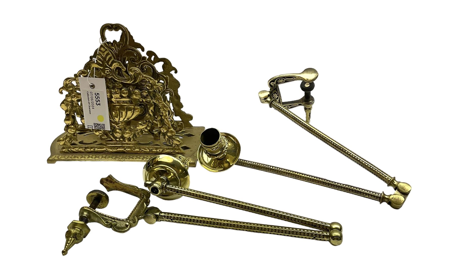 Brass letter rack, with two divisions, the pierced front and back modelled as a flowering urn hung with floral swags, H18cm, together with a pair of gilt metal extendable candle sconces, fully extended L50cm