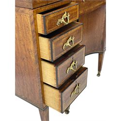 Late 19th century mahogany and satinwood dressing chest, the raised middle section hinges to reveal an interior fitted with lidded compartments, removable tray, single drawer and glass scent bottles, lift-up bevelled mirror with adjustable hinged mechanism, fitted with a further eight cock-beaded graduating drawers and curved kneehole with double cupboard, square tapering supports on brass cups and castors, inlaid throughout with checkered stringing, ornate Rococo cast gilt metal handles