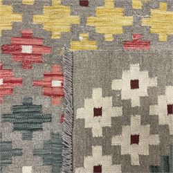 Anatolian Turkish kilim, light grey ground and decorated with multi-coloured geometric star motifs