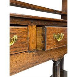 18th century oak dresser, raised three tier plate rack with moulded cresting rail, rectangular top over three drawers, the drawer fronts with moulded edges, turned supports united by pot board base 