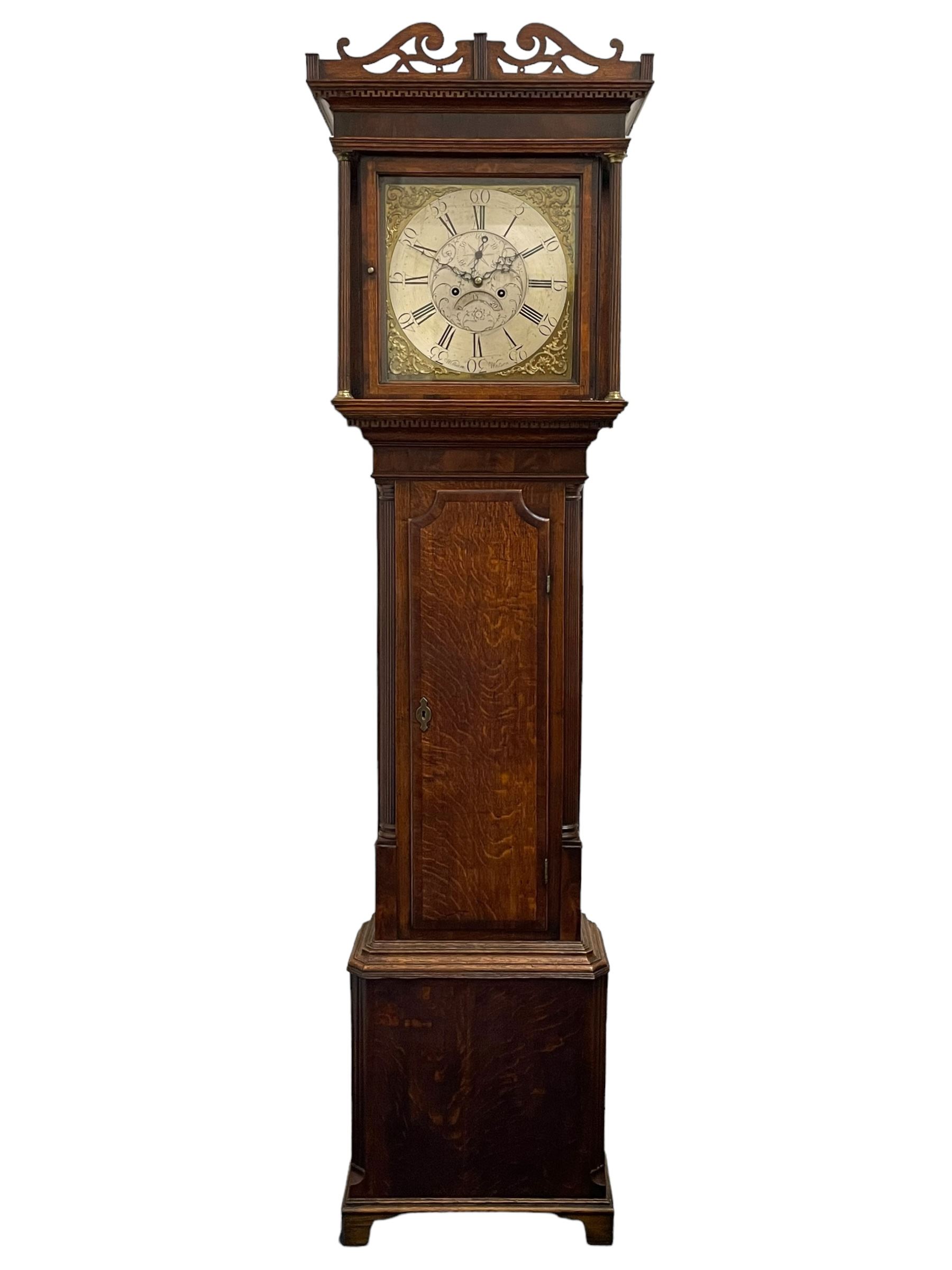 William Watson of  Blackburn (Lancs)  - late 18th century 8-day oak and mahogany cross banded longcase clock, with a flat top and open fretwork above, deep cornice with dogtooth moulding and frieze beneath, square hood door flanked by reeded pilasters with brass capitals, trunk with  reeded quarter columns, long trunk door with concave corners on a plinth with canted corners on bracket feet, brass dial with cast brass spandrels, broad silvered chapter ring with Roman numerals and five-minute Arabic's, a profusely engraved and silvered dial centre with seconds dial, matching steel hands and calendar aperture, hourly rack striking movement with a recoil anchor escapement. With weights, pendulum and key. 
William Watson of Northgate, Blackburn, is recorded as working c1770-1814 . As with this clock he frequently signed some of his clocks without a placename.