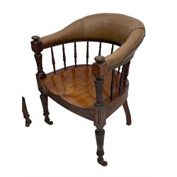 Pair of late Victorian walnut tub-shaped elbow chairs, the cushioned cresting rail upholstered in leather on spindle turned supports, dished saddle seat on turned supports