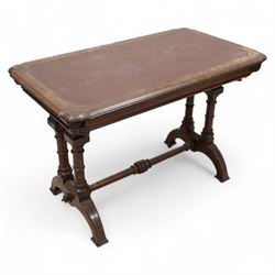 Late 19th century Aesthetic Movement inlaid walnut library table, shaped rectangular top with moulded and banded edge, inset with oxblood leather writing surface, fitted with two frieze drawers, raised on ring turned twin-pillar end supports with carved acanthus capitals terminating to arched supports with ebony inlay, united by turned stretcher 