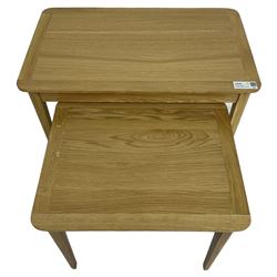 Contemporary light oak nest of two tables, rectangular top over tapering supports