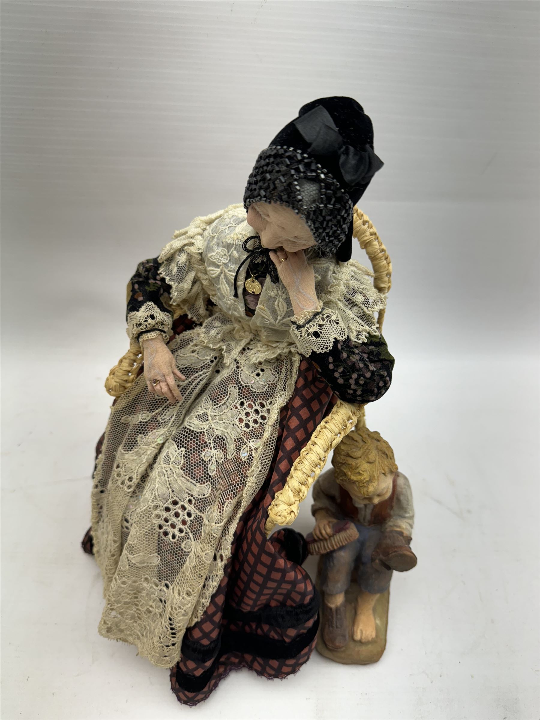 Anna Meszaros (Hungarian 1905-1998): 'My Great Granny', handmade needlework figurine, together with small plaster cast of a young boy by the same artist, granny H30cm
Auctioneer's Note: Anna Meszaros came to England from her native Hungary in 1959 to marry an English businessman she met while demonstrating her art at the 1958 Brussels Exhibition. Shortly before she left for England she was awarded the title of Folk Artist Master by the Hungarian Government. Anna was a gifted painter of mainly portraits and sculptress before starting to make her figurines which are completely hand made and unique, each with a character and expression of its own. The hands, feet and face are sculptured by layering the material and pulling the features into place with needle and thread. She died in Hull in 1998