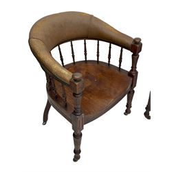 Pair of late Victorian walnut tub-shaped elbow chairs, the cushioned cresting rail upholstered in leather on spindle turned supports, dished saddle seat on turned supports