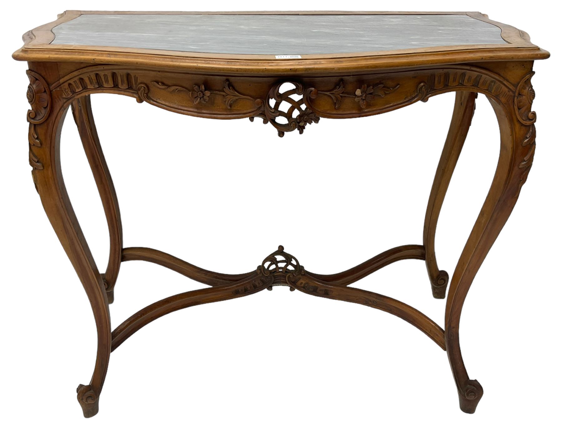 French design walnut console table, shaped top with inset grey marble panel, the frieze pierced and carved with scrolling foliage and applied flower heads, raised on cabriole supports with cartouche carved knees, united by shaped X-stretcher