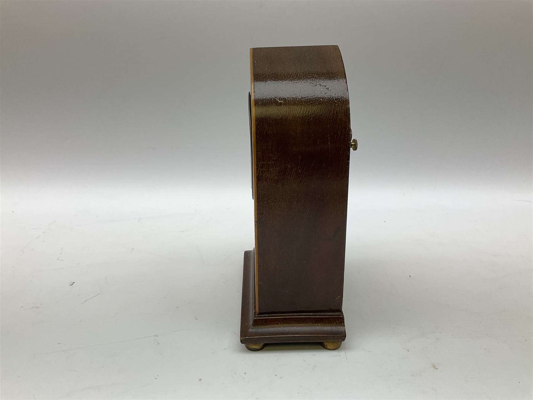 Edwardian mahogany and boxwood strung mantel lancet clock, the dial with black Roman numerals, marked 8 Day Made in U.S.A, upon four compressed bun type feet, H18.5cm