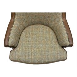 Wood Bros - contemporary wingback armchair, high back with curved wings upholstered in herringbone patterned fabric, accented with leather trim and brass nailhead studs, resting on cabriole front feet 