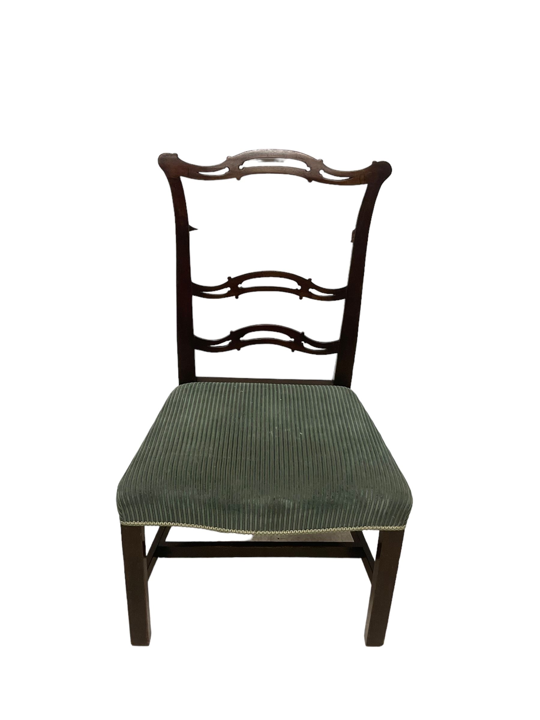 Set of twelve (10+2) Chippendale revival stained beech dining chairs, pierced waived ladder backs with over-stuffed over seats, on square moulded supports joined by stretchers