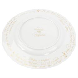 Rosenthal Die Zauberflote pattern dinner plate, designed by Von Bjorn Wiinblad, of circular form the gilt rim decorated in relief with stylised scene's from the Mozart opera,with opera reference inscriptions in German in gilt verso, with printed mark beneath, D32cm