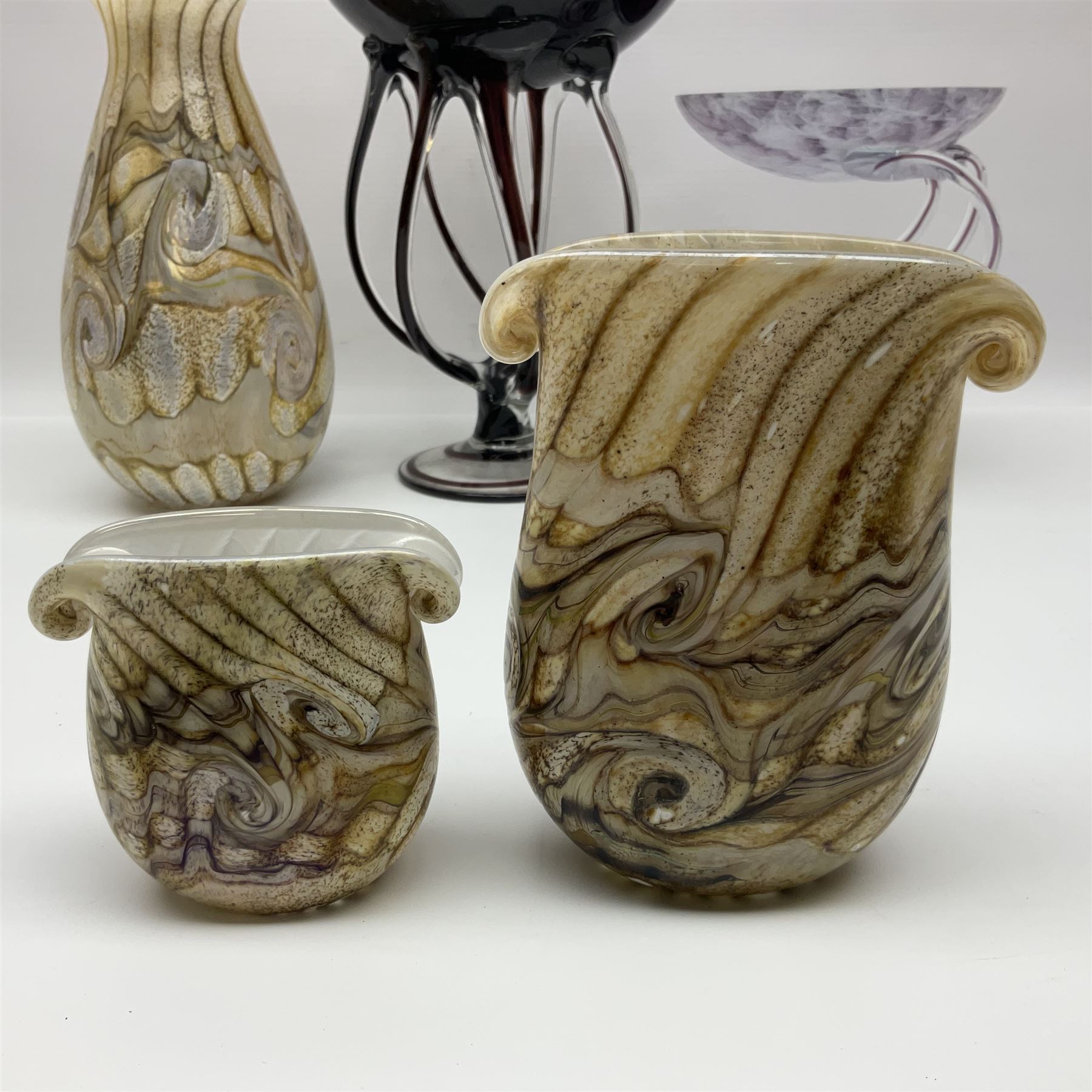 Three Gozo Glass vases of various shapes, decorated with mottled and swirled textured designs in shades of brown, together with two murano  pedestal dishes, largest dish H23cm