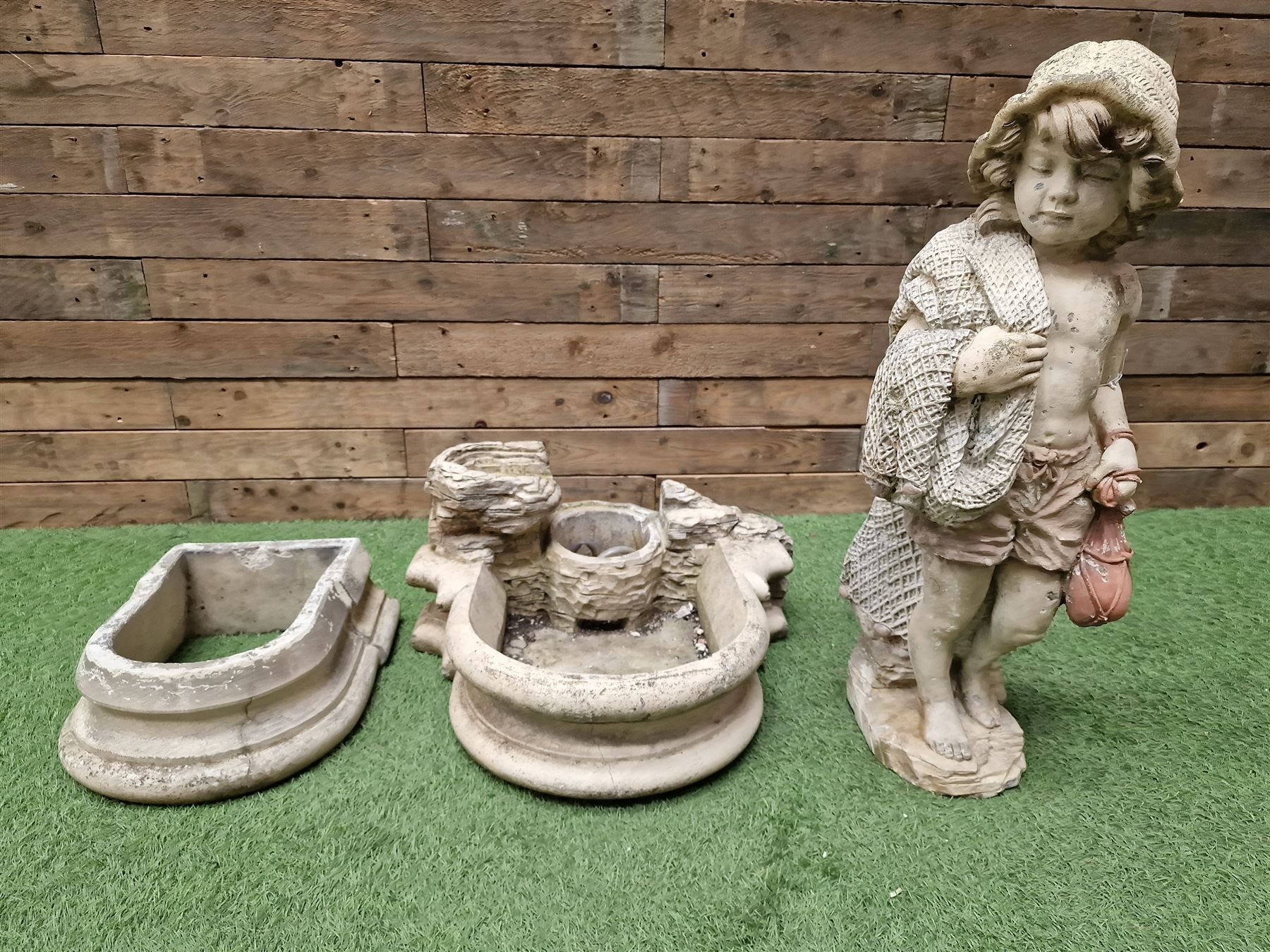 Three section cast stone garden figure of a boy carrying fishing net and a satchel with a water feature together with a cast stone planter on plinth - THIS LOT IS TO BE COLLECTED BY APPOINTMENT FROM DUGGLEBY STORAGE, GREAT HILL, EASTFIELD, SCARBOROUGH, YO11 3TX