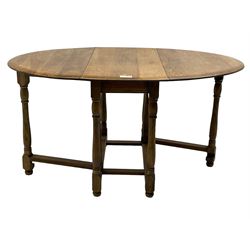 Mid-to-late 20th century oak and beech drop-leaf dining table, gate-leg action base with turned supports