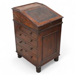 Early 19th century rosewood Davenport, sliding top section enclosed by moulded lid with leather inset, the interior fitted with single drawer, four graduating cock-beaded drawers to the right hand side and four false drawers to the opposing side, on turned feet 