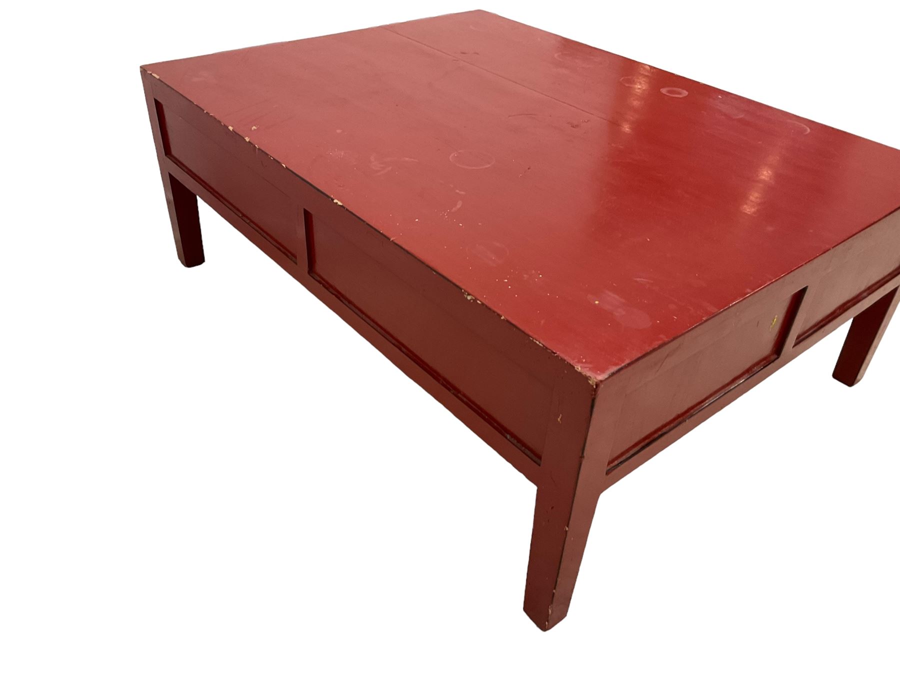 Chinese design red lacquered coffee table, rectangular form on square tapering supports, fitted with two drawers 