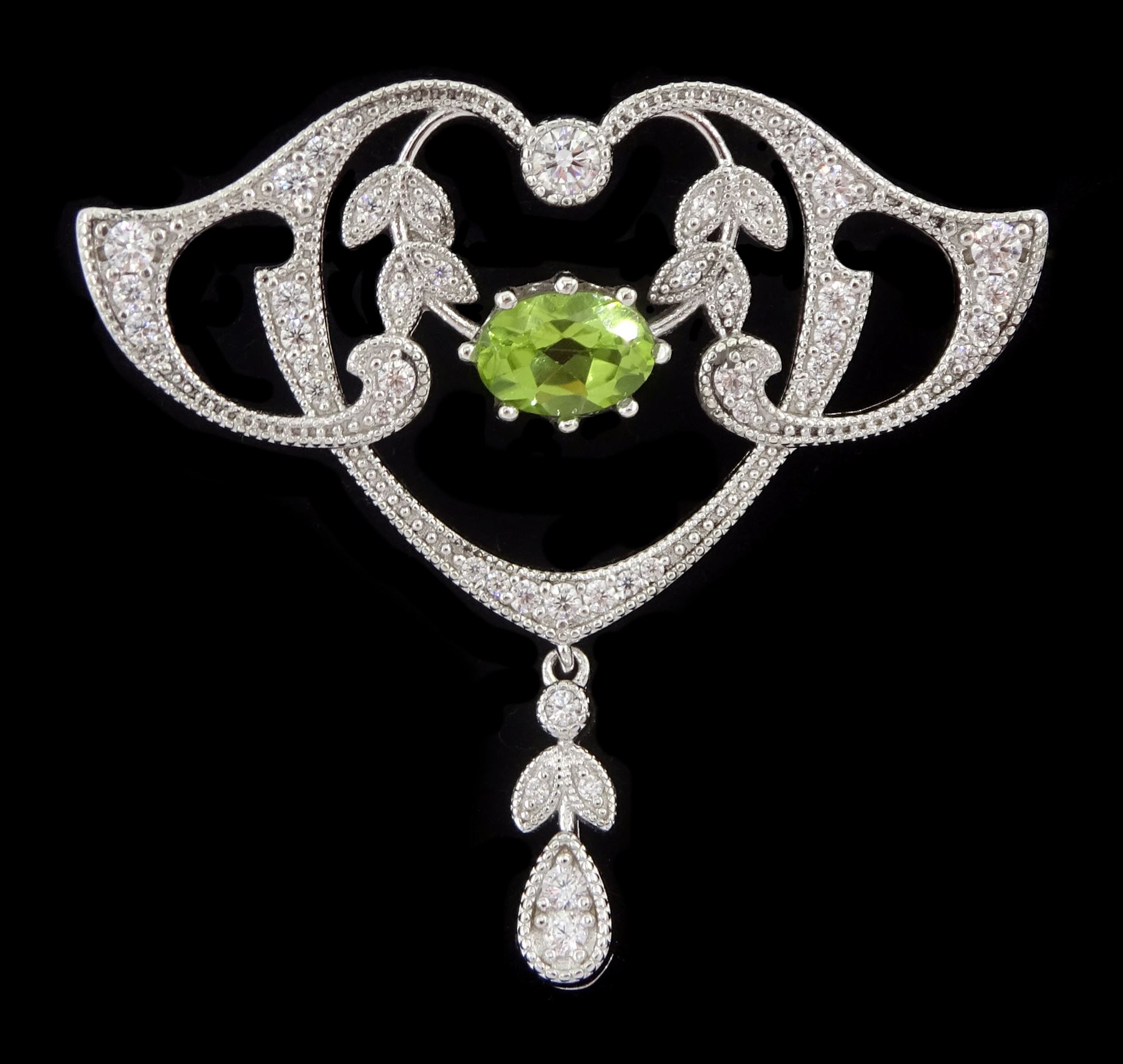 Silver milgrain set peridot and cubic zirconia openwork brooch