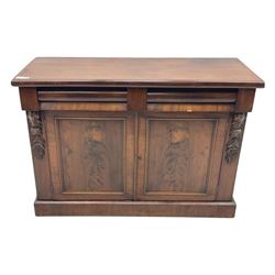 Mid 19th century mahogany sideboard, rectangular top over two frieze drawers with rounded edges, flanked by floral carved corbels, over two panelled cupboard doors, raised on a plinth base