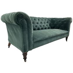 Victorian hardwood-framed Chesterfield sofa, traditional shape with low back and rolled arms, upholstered in teal buttoned fabric, on turned front feet with brass and ceramic castors 